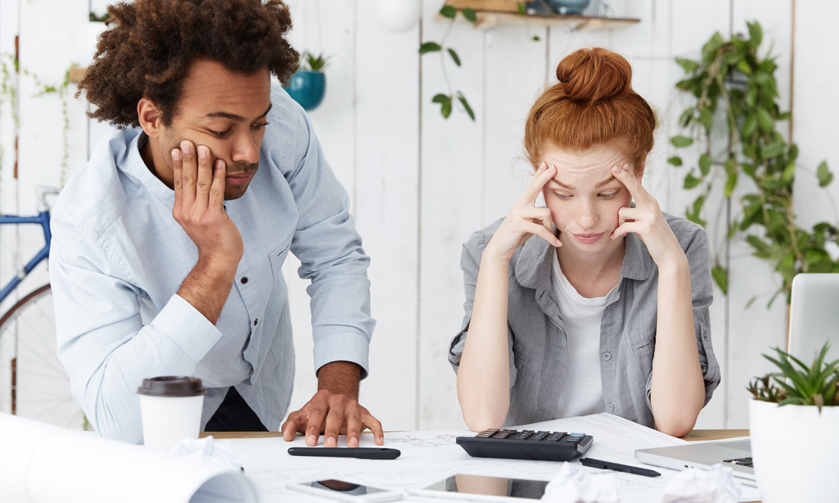 photo of a young couple that has refinanced their mortgage and made some mistakes in the process