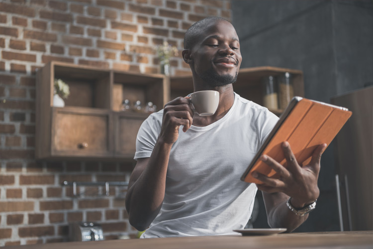 photo of a young man reviewing his credit score upon applying for mortgage financing in Alberta with Advantage Mortgage, a Leduc area mortgage broker